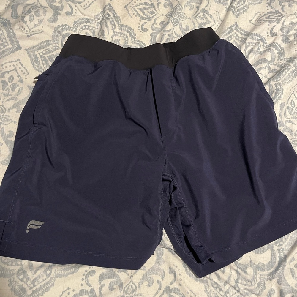 Fabletics workout shorts with compression liners.